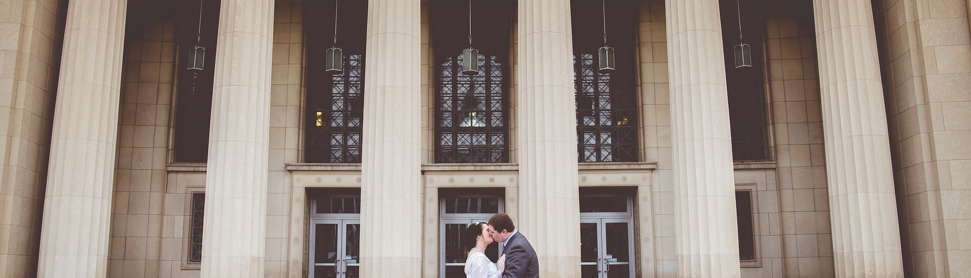 Married couple kiss on courtroom steps