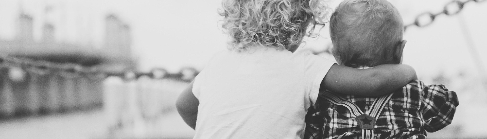 two young children embrace