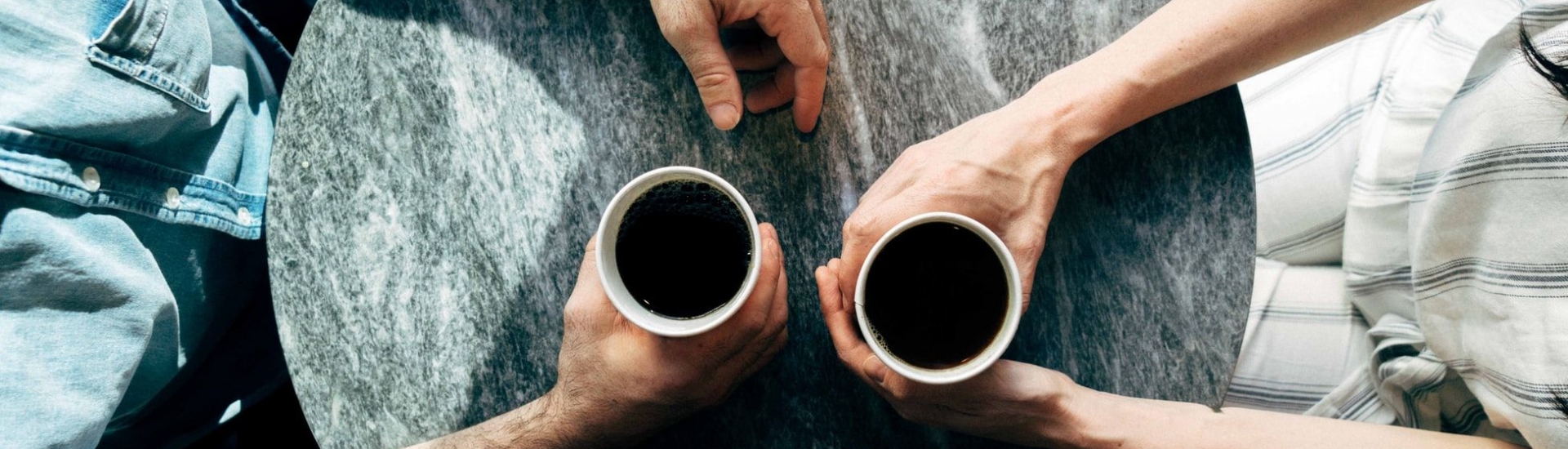 Two people having coffee together