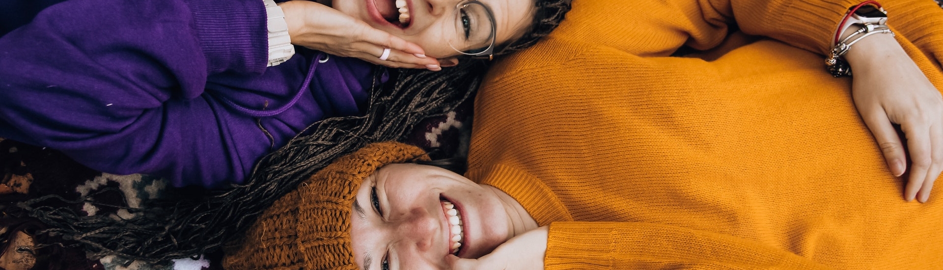 Two friends laughing together